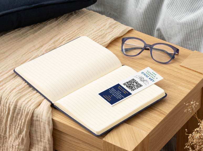 Civic Key bookmark resting inside an open notebook.